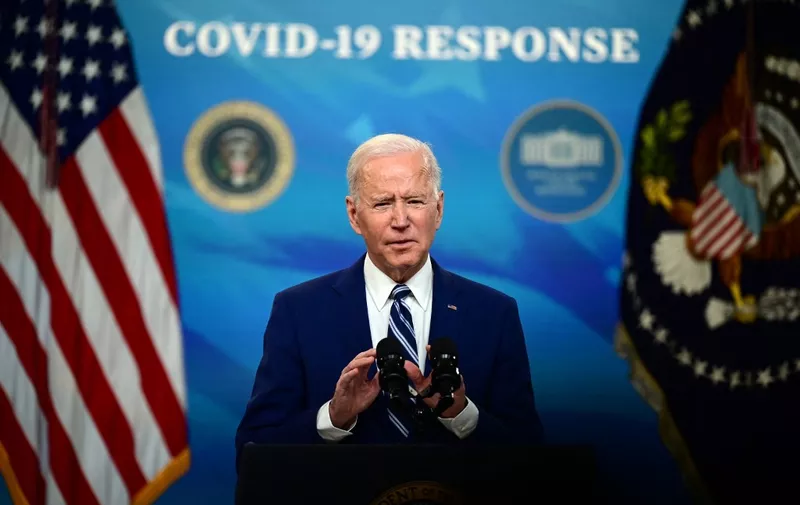 US President Joe Biden with Vice President Kamala Harris (not shown), delivers remarks on Covid-19 response and vaccinations in the South Court Auditorium of the White House in Washington DC, on March 29, 2021. - US President Joe Biden's administration on March 29, 2021 announced a set of new actions to ensure that 90 percent of adults will be eligible for vaccination against Covid by April 19. (Photo by JIM WATSON / AFP)