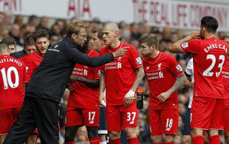 Liverpool's German manager Jurgen Klopp talks to his players during a break in play during the English Premier League football match between Tottenham Hotspur and Liverpool at White Hart Lane in north London on October 17, 2015. AFP PHOTO / IAN KINGTON

RESTRICTED TO EDITORIAL USE. No use with unauthorized audio, video, data, fixture lists, club/league logos or 'live' services. Online in-match use limited to 75 images, no video emulation. No use in betting, games or single club/league/player publications.