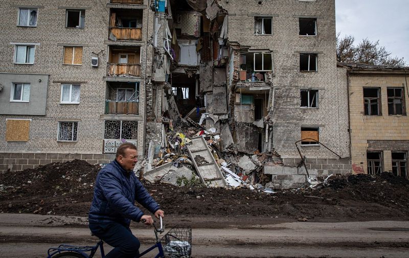 A man rides a bicycle past the ruins of a residential building caused by Russian airstrikes in Bakhmut. Donetsk(Donbas) region is under heavy attack, as Ukraine and Russian forces contest the area, amid the Russian full invasion of Ukraine started on February 24, the war that has killed numerous civilians and soldiers.
Ruins in Bakhmut, Ukraine - 22 May 2022,Image: 694402109, License: Rights-managed, Restrictions: , Model Release: no, Credit line: Profimedia