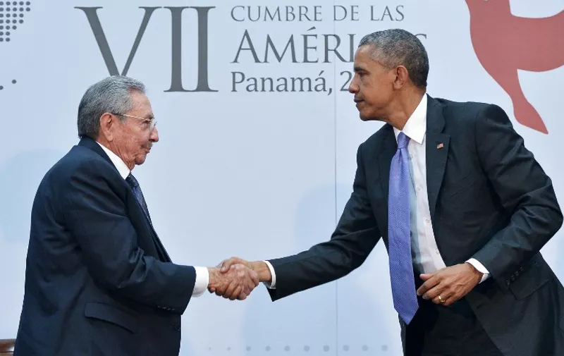 US President Barack Obama (R) shakes hands with Cuba&#8217;s President Raul Castro (L) on the sidelines of the Summit of the Americas at the ATLAPA Convention center on April 11, 2015 in Panama City. AFP PHOTO/MANDEL NGAN