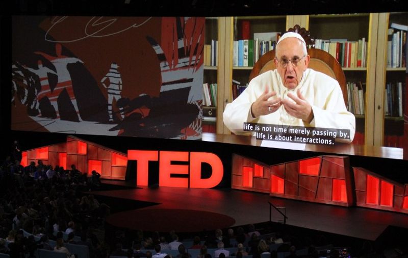 Pope Francis speaks during the TED Conference, urging people to connect with and understand others, during a video presentation at the annual scientific, cultural and academic event in Vancouver, Canada, April 25, 2017.  / AFP PHOTO / Glenn CHAPMAN