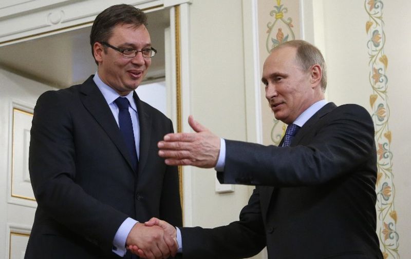 Russia's President Vladimir Putin (R) invites for talks Serbian Prime Minister Aleksandar Vucic (L) during their meeting in the Novo-Ogaryovo residence, outside Moscow, on July 8, 2014. Russia and Serbia are ready to start procedures of signing an agreement on the South Stream gas pipeline in the next few days, the Itar-TASS news agency quoted Russia's Prime Minister Dmitry Medvedev as saying yesterday after his talks with Vucic. The 16-billion-euro ($21.8 billion) South Stream pipeline would stretch nearly 2,500 kilometres (1,500 miles) from Russia under the Black Sea to Bulgaria, Serbia, Hungary and Slovenia before reaching a terminal in Italy. It is an attempt to reduce Moscow's reliance on Ukraine as a transit country for its natural gas following disputes with Kiev in 2006 and 2009 that led to interruptions of gas supplies to Europe. AFP PHOTO / POOL/ MAXIM SHIPENKOV