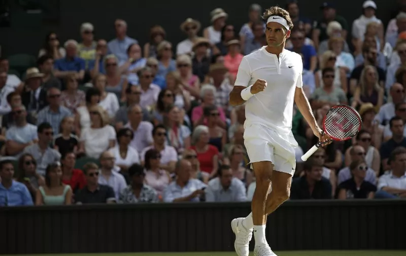 Switzerland's Roger Federer celebrates going 2-1 up in the third set against Britain's Andy Murray during their men's semi-final match on day eleven of the 2015 Wimbledon Championships at The All England Tennis Club in Wimbledon, southwest London, on July 10, 2015.   RESTRICTED TO EDITORIAL USE  --  AFP PHOTO / ADRIAN DENNIS