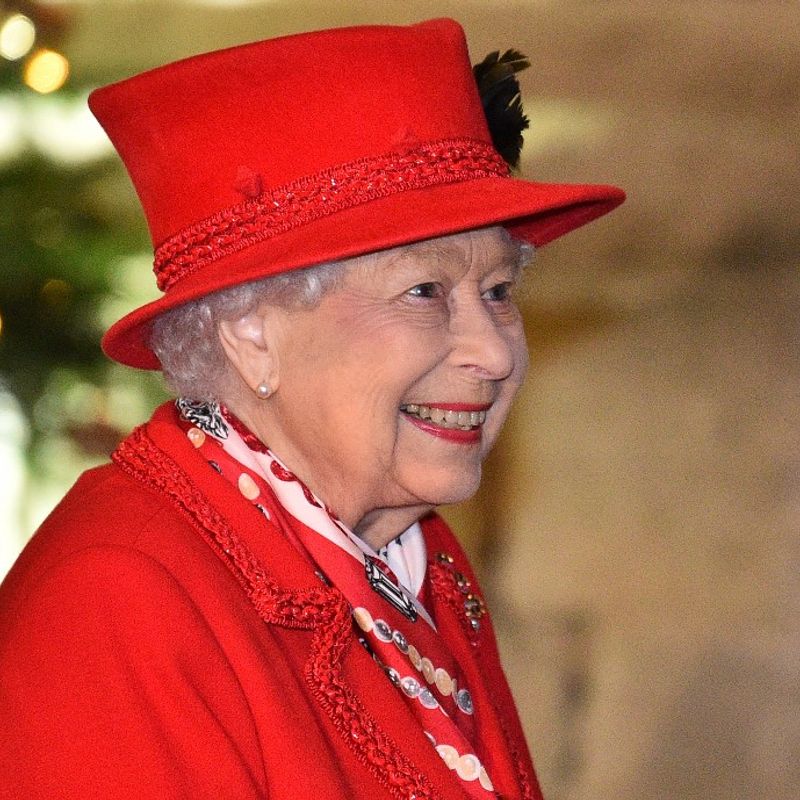 Britain's Queen Elizabeth II thanks local volunteers and key workers for the work they are doing during the coronavirus pandemic and over Christmas in the quadrangle of Windsor Castle in Windsor, west of London, on December 8, 2020 - The Queen and members of the royal family gave thanks to local volunteers and key workers for their work in helping others during the coronavirus pandemic and over Christmas at Windsor Castle in what was also the final stop for the Duke and Duchess of Cambridge on their tour of England, Wales and Scotland. (Photo by Glyn KIRK / various sources / AFP)