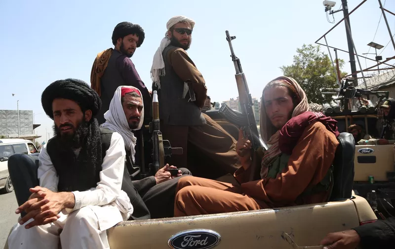 6626194 16.08.2021 Taliban fighters are seen on the back of a vehicle in Kabul, Afghanistan. The Taliban (designated terrorist and banned in Russia) took over the capital city of Kabul on August 15, sweeping to power in Afghanistan as President Ashraf Ghani resigned and fled abroad.,Image: 627268062, License: Rights-managed, Restrictions: , Model Release: no, Credit line: Profimedia