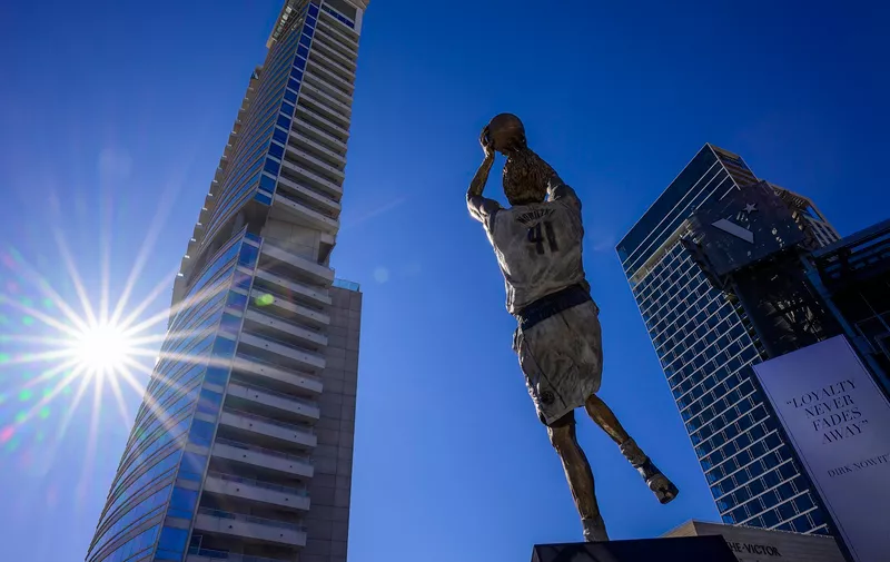 Dec 25, 2022; Dallas, Texas, USA; A general view of the Dallas city skyline and the statue by sculptor Omri Amrany honoring former Dallas Mavericks power forward Dirk Nowitzki before the game between the Dallas Mavericks and the Los Angeles Lakers American Airlines Center . Mandatory Credit: Jerome Miron-USA TODAY Sports