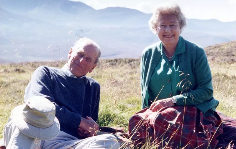 A handout photograph taken by Britain's Sophie, Countess of Wessex, and released by Buckingham Palace on April 16, 2021, shows Britain's Queen Elizabeth II and her husband Britain's Prince Philip, the Duke of Edinburgh, at the top of the Coyles of Muick near Ballater in the Cairngorms National Park in Scotland in 2003. - Philip, who was married to Elizabeth for 73 years, died on April 9, 2021, aged 99, just weeks after a month-long stay in hospital for treatment to a heart condition and an infection. (Photo by The Countess of Wessex / BUCKINGHAM PALACE / AFP)