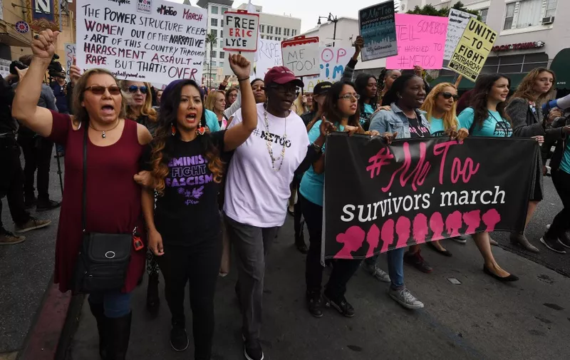 Victims of sexual harassment, sexual assault, sexual abuse and their supporters protest during a #MeToo march in Hollywood, California on November 12, 2017. Several hundred women gathered in front of the Dolby Theatre in Hollywood before marching to the CNN building to hold a rally. (Photo by Mark RALSTON / AFP)