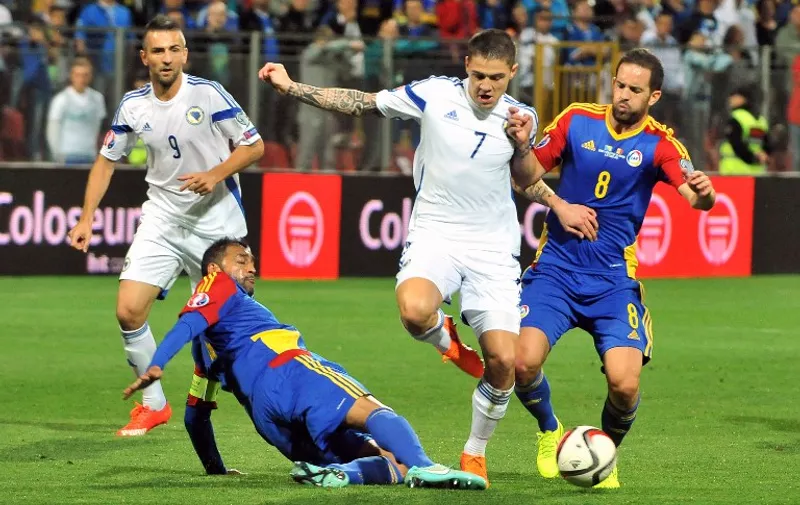 Bosnia and Herzegovina's Muhamed Besic (2nd R) vies with Andorra's Marcio Vieira (R) during the Euro 2016 Group B qualifying match between Bosnia and Herzegovina and Andorra in Zenica, on September 6, 2015. AFP PHOTO / ELVIS BARUKCIC