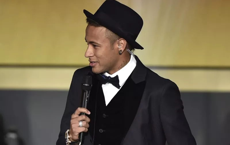 FC Barcelona and Brazils forward  Neymar speaks on stage  during the 2015 FIFA Ballon d'Or award ceremony at the Kongresshaus in Zurich on January 11, 2016. AFP PHOTO / FABRICE COFFRINI / AFP / FABRICE COFFRINI