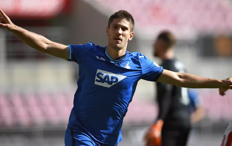 COLOGNE, GERMANY - SEPTEMBER 19: Andrej Kramaric of TSG 1899 Hoffenheim celebrates after scoring his team's first goal during the Bundesliga match between 1. FC Koeln and TSG Hoffenheim at RheinEnergieStadion on September 19, 2020 in Cologne, Germany. Fans are set to return to Bundesliga stadiums in Germany despite to the ongoing Coronavirus Pandemic. Up to 20% of stadium's capacity are allowed to be filled. Final decisions are left to local health authorities and are subject to club's hygiene concepts and the infection numbers in the corresponding region. The match in Cologne is played behind closed doors due to the high number of new Covid-19 cases in the city of Cologne. (Photo by Frederic Scheidemann/Getty Images)