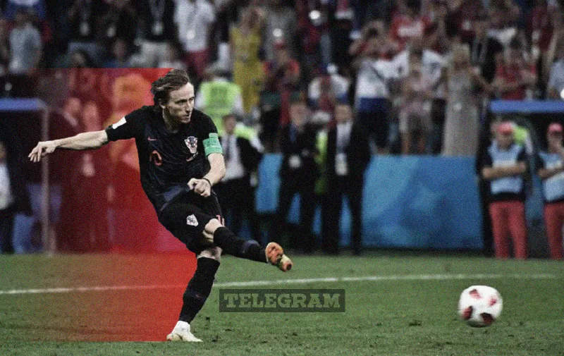 Croatia's midfielder Luka Modric converts a penalty during the Russia 2018 World Cup quarter-final football match between Russia and Croatia at the Fisht Stadium in Sochi on July 7, 2018. / AFP PHOTO / Nelson Almeida / RESTRICTED TO EDITORIAL USE - NO MOBILE PUSH ALERTS/DOWNLOADS