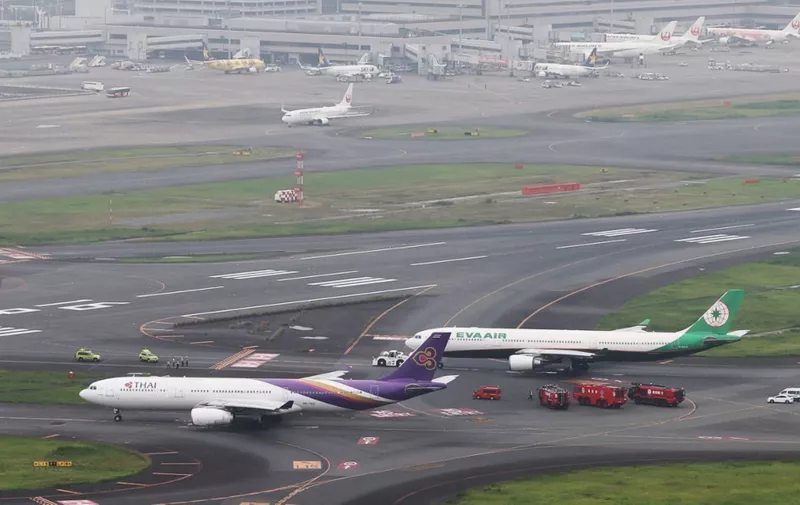 Aircrafts of Thai Airways and Eva Airways are believed to have collided on the runway at Haneda International Airport in Ota Ward, Tokyo on June 10, 2023.( The Yomiuri Shimbun ) (Photo by Kenichi Matsuda / Yomiuri / The Yomiuri Shimbun via AFP)