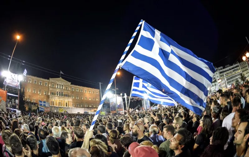 Thousands on 'NO' protesters gather in front of the parliament building in Athens on July 3, 2015. Greek Prime Minister Alexis Tsipras was cheered wildly as he arrived Friday for the rally in Athens' Syntagma Square, two days before a crucial bailout referendum. AFP PHOTO / ANDREAS SOLARO