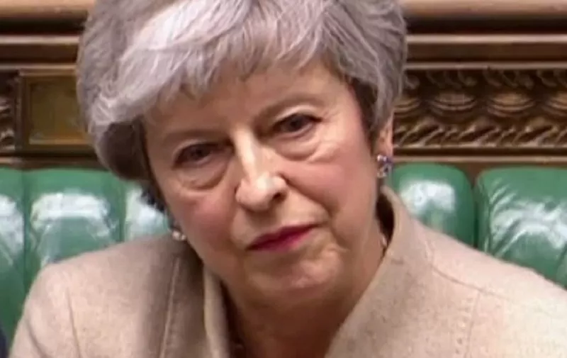 A video grab from footage broadcast by the UK Parliament's Parliamentary Recording Unit (PRU) shows Britain's Prime Minister Theresa May reacting as Labour Party leader Jeremy Corbyn speaks on a point of order in the House of Commons in London on March 29, 2019 after MPs rejected her EU Withdrawl deal for a third time. - MPs voted to reject for a third time Prime Minister Theresa May's Brexit divorce deal by 58 votes. (Photo by - / PRU / AFP) / RESTRICTED TO EDITORIAL USE - MANDATORY CREDIT " AFP PHOTO / PRU " - NO USE FOR ENTERTAINMENT, SATIRICAL, MARKETING OR ADVERTISING CAMPAIGNS - EDITORS NOTE THE IMAGE HAS BEEN DIGITALLY ALTERED AT SOURCE TO OBSCURE VISIBLE DOCUMENTS