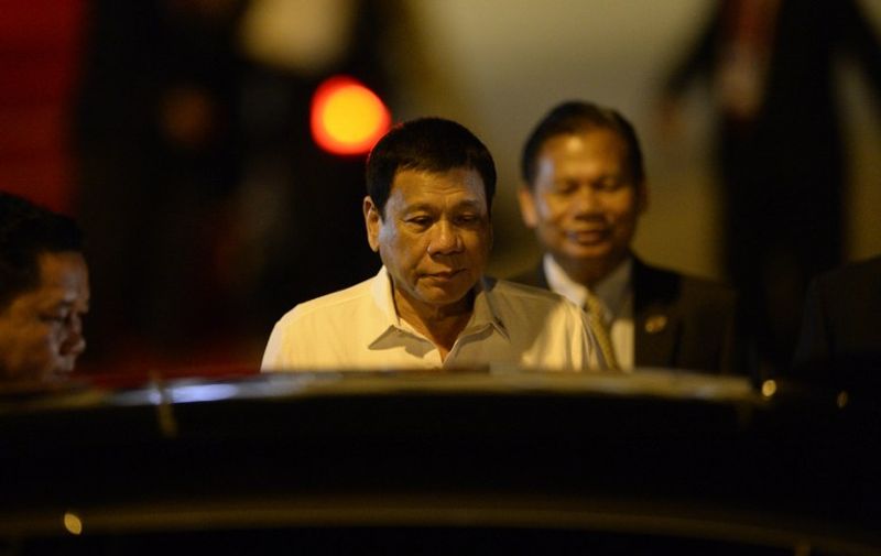 Philippine President Rodrigo Duterte arrives at the Wattay International Airport in Vientiane on September 5, 2016 for the 28th Association of Southeast Asian Nations (ASEAN) Summit to be held September 6-8. / AFP PHOTO / NOEL CELIS