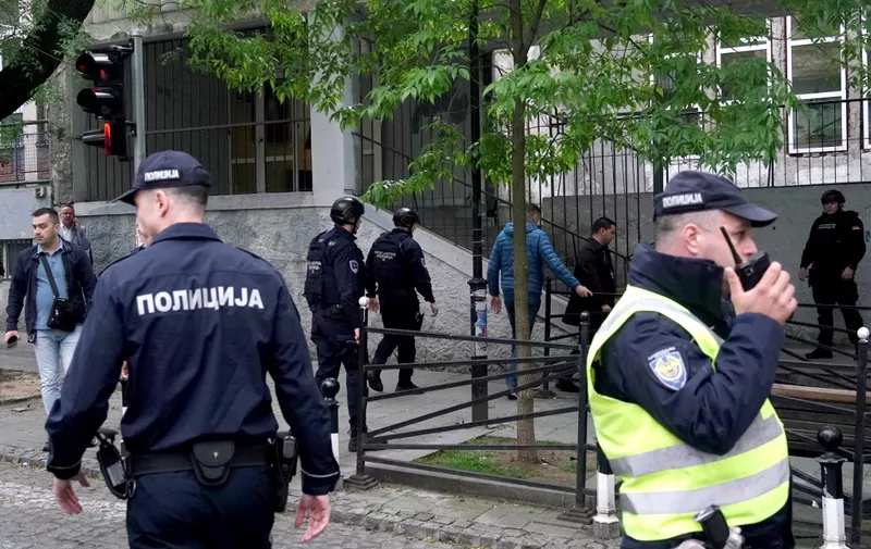 Police officers arrive following a shooting at a school in the capital Belgrade on May 3, 2023. Serbian police arrested a student following a shooting at an elementary school in the capital Belgrade on May 3, 2023, the interior ministry said. The shooting occurred at 8:40 am local time (06:40 GMT) at an elementary school in Belgrade's downtown Vracar district. (Photo by Oliver Bunic / AFP)