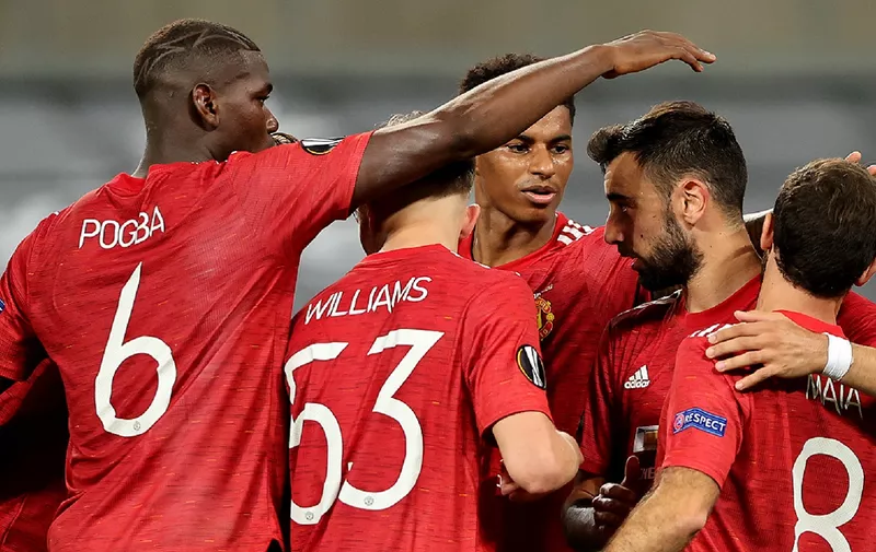 COLOGNE, GERMANY - AUGUST 10: Bruno Fernandes of Manchester United celebrates with teammates after scoring his sides first goal  during the UEFA Europa League Quarter Final between Manchester United and FC Kobenhavn at RheinEnergieStadion on August 10, 2020 in Cologne, Germany. (Photo by Wolfgang Rattay/Pool via Getty Images)