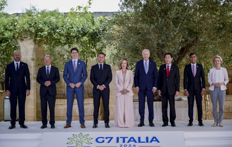 APULIA, ITALY - JUNE 13: European Council President Charles Michell (L), German Chancellor Olaf Scholz (2nd L), Canada Prime Minister Justin Trudeau (3rd L), French President Emmanuel Macron (4th L), Italian Prime Minister Giorgia Meloni (C), U.S. President Joe Biden (4th R), Japan Prime Minister Fumio Kishida (3rd R), British Prime Minister Rishi Sunak (2nd R) and President of the European Commission Ursula Von Der Leyen (R) pose for a family photo for 50th G7 summit in Brindisi, Apulia, region of Italy on June 13, 2024. Valeria Ferraro / Anadolu (Photo by Valeria Ferraro / ANADOLU / Anadolu via AFP)