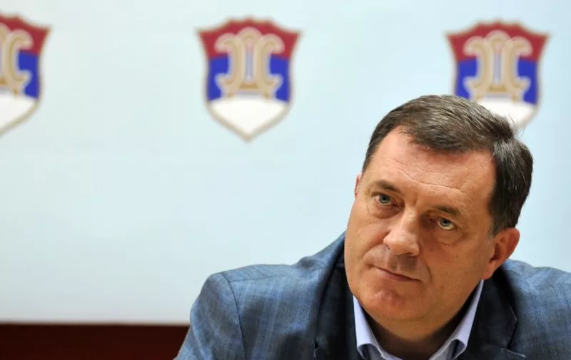Milorad Dodik, leader of the "Union of Independant Socialdemocrates" (SNSD) listens to a journalist's question during a press conference in Brcko, on September 26, 2011. After series of meetings, leaders of six most influential political parties in Bosnia and Herzegovina did not find an acceptable solution on division of ministries and other vital political functions, so the country remains wthout an operational government after the national elections in October 2010. AFP PHOTO ELVIS BARUKCIC / AFP / ELVIS BARUKCIC