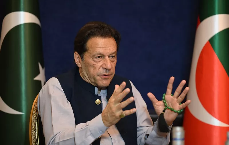 Pakistan's former Prime Minister Imran Khan speaks during an interview with AFP at his residence in Lahore on March 15, 2023. Former Pakistan Prime Minister Imran Khan and his wife were sentenced on January 31, 2024, to 14 years in jail, local media said, after being found guilty of graft in a case involving gifts he received while premier. (Photo by Aamir QURESHI / AFP)