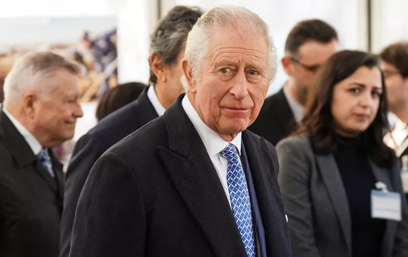 Britain's King Charles III reacts as he meets with members of the Syrian diaspora community after officially launching Syria's House, a temporary Syrian community tent, in Trafalgar Square, central London, on February 14, 2023 where members of the Syrian community can get together to support those affected by the recent earthquakes in north-west Syria. - The 7.8-magnitude earthquake on February 6 has killed at least 35,000 people and devastated swathes of Syria and neighbouring Turkey. (Photo by Stefan Rousseau / POOL / AFP)