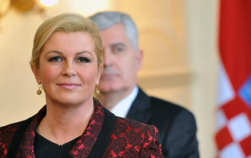 Croatian President, Kolinda Grabar Kitarovic (L) gives a press conference after meeting with members of Bosnia and Herzegovina's tripartite presidency in Sarajevo on March 3, 2015. Kitarovic is on a one-day official visit to the Bosnian capital where she is scheduled to hold several meetings with Bosnia's top political leaders. Kitarovic's visit to Bosnia is her first official visit to another country since she was sworn in as president of Croatia in February. AFP PHOTO / ELVIS BARUKCIC