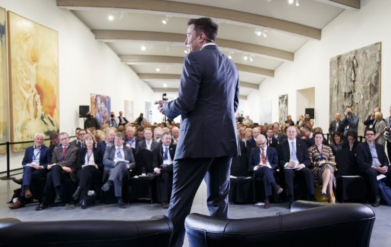 Elon Musk, CEO of Tesla Motors addresses an environmental conference at Astrup Fearnley Museum in Oslo, Norway on April 21, 2016.  / AFP PHOTO / NTB Scanpix / Heiko JUNGE / Norway OUT