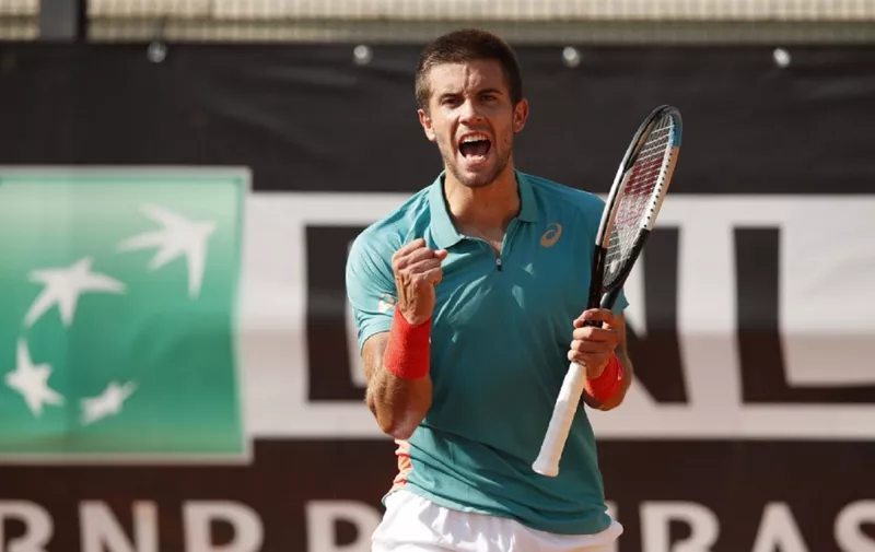 Borna Coric of Croatia celebrates defeating Cristian Garin of Chile on day one of the Internazionali BNL D'Italia ATP tour at Foro Italico on September 14, 2020 in Rome, Italy. (Photo by Clive Brunskill / POOL / AFP)