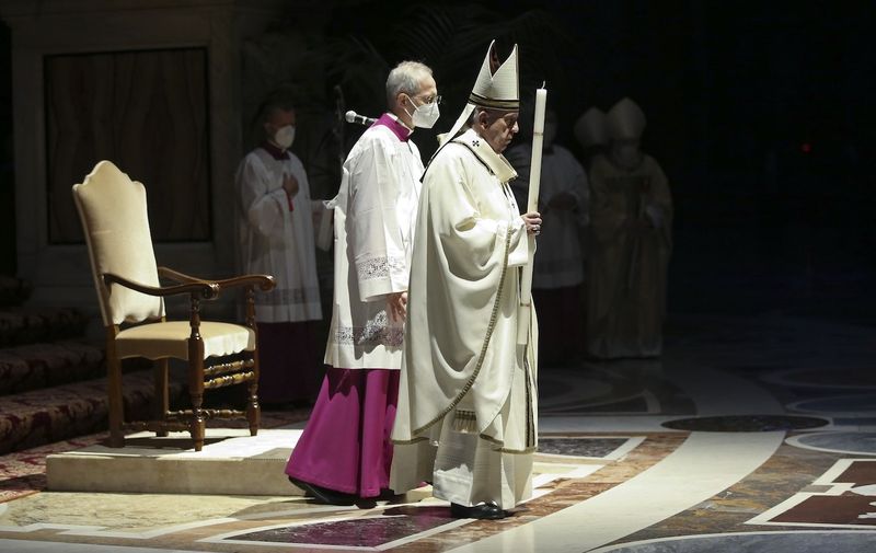 Rome, ITALY  - Pope Francis celebrating the Easter Vigil at St. Peter's Basilica in The Vatican during the Covid-19 coronavirus pandemic.

BACKGRID UK 4 APRIL 2021,Image: 603297429, License: Rights-managed, Restrictions: RIGHTS: WORLDWIDE EXCEPT IN AUSTRALIA, CANADA, ITALY, NEW ZEALAND, UNITED STATES, Model Release: no