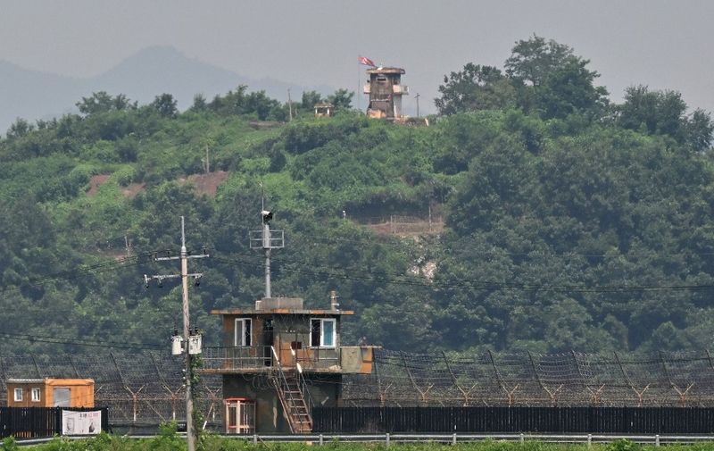 A North Korean guard post (top) and a South Korean guard post (bottom) face each other as seen from the border city of Paju on July 27, 2023. (Photo by Jung Yeon-je / AFP)