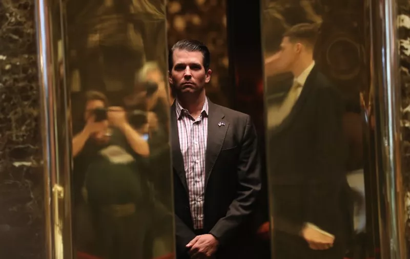 (FILES): This file photo taken on January 17, 2017 shows Donald Trump Jr. arriving at Trump Tower in New York.  
Donald Trump's eldest son admitted Monday, July 10, 2017 to meeting a Russian lawyer to get dirt on his father's 2016 rival Hillary Clinton, thrusting the White House deep into another Russia-related scandal. Donald Trump Jr confirmed reports that he was on the trail of damning information on the Democrat vying to become America's first woman president, when he met Natalia Veselnitskaya in June 2016. "Obviously, I'm the first person on a campaign to ever take a meeting to hear info about an opponent," Trump's son said in a tweet, claiming that it "went nowhere" but he "had to listen." The FBI and Congress are investigating whether the Trump campaign colluded with Russia to influence the 2016 presidential vote.  US intelligence agencies have concluded that Russian President Vladimir Putin approved a mass effort to tilt the election in Trump's favor, including hacking and leaking embarrassing emails from Democrats.
 / AFP PHOTO / GETTY IMAGES NORTH AMERICA / JOHN MOORE