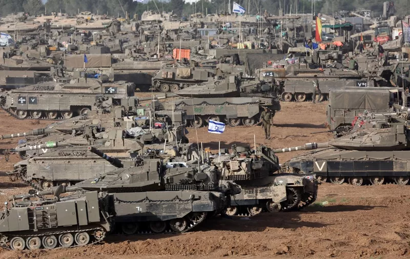Israeli army battle tanks are positioned in southern Israel near the border with the Gaza Strip on May 9, 2024, amid the ongoing conflict in the Palestinian territory between Israel and the Hamas movement. (Photo by AHMAD GHARABLI / AFP)