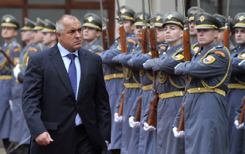 Bulgarian Prime Minister Bojko Borisov (L) reacts as he reviews a guard of honor with his Slovak counterpart on November 12, 2012  in Bratislava, Slovakia. Borisov arrived for a two day state visit. AFP PHOTO / SAMUEL KUBANI (Photo by SAMUEL KUBANI / AFP)