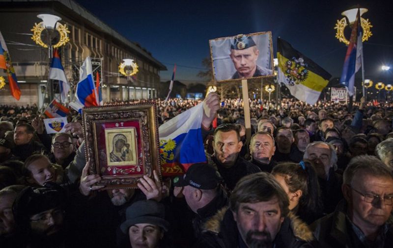 Supporters of Serbian President and Russian President Vladimir Putin wait for their arrival in front of Belgrade's Saint Sava Church on January 17, 2019. - Russian President Vladimir Putin on January 17, 2019 called for stability in the Balkans during a pageantry-filled visit to Serbia, a key Moscow ally in a tense region on Europe's edge. Although Serbia and all of its neighbours aspire to join the European Union, Belgrade has nurtured close ties with Russia, its historical "Orthodox big brother" whose people also share Slavic origins. (Photo by VLADIMIR ZIVOJINOVIC / AFP)