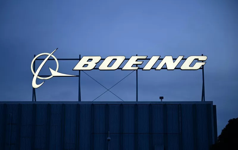 (FILES) The Boeing Co. logo is displayed outside of company offices near Los Angeles International Airport (LAX) in El Segundo, California on January 18, 2024. The US Justice Department on May 14, 2024, said Boeing can be prosecuted for two subsequent 737 Max crashes that killed 346 people approximately five years ago. (Photo by Patrick T. Fallon / AFP)
