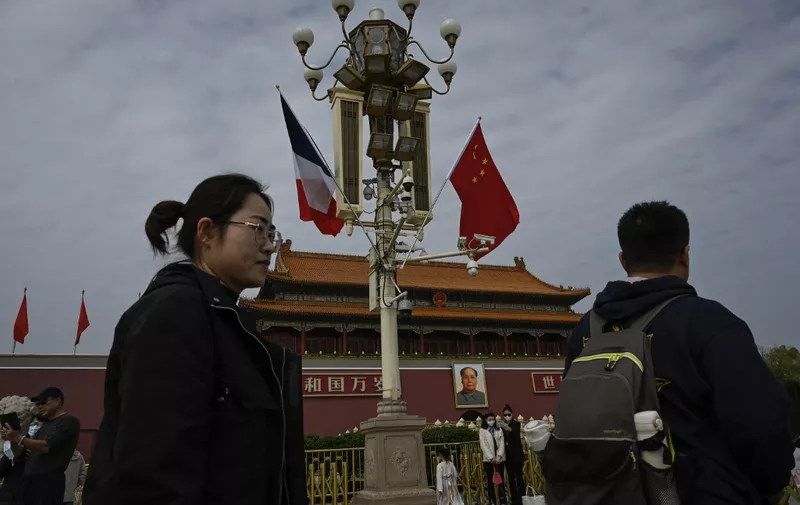 The national flags of France and China fluter near Tiananmen Gate as French President Emmanuel Macron visits in Beijing on April 5, 2023. (Photo by Jade GAO / AFP)