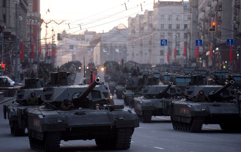 Russian new ARMATA T-14 tanks move along a street in Moscow as day breaks following Victory Day military parade night training on May 5, 2015. Russia celebrates the 70th anniversary of the 1945 defeat of Nazi Germany on May 9. AFP PHOTO / ALEXANDER UTKIN