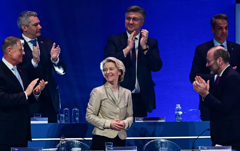 European Commission President Ursula von der Leyen (C) is applauded by (L-R) Romania's President Klaus Iohannis, Austria's Chancellor Karl Nehammer, Croatia's Prime Minister Andrej Plenkovic, Greece's Prime Minister Kyriakos Mitsotakis and the President of the European People's Party (EPP) Manfred Weber after she was elected as their candidate for a second term, during the EPP's Congress in Bucharest, Romania, on March 7, 2024. The conservative European People's Party (EPP) -- the biggest force in the EU parliament -- endorsed Ursula von der Leyen's bid for a second term as chief of the bloc. (Photo by Daniel MIHAILESCU / AFP)