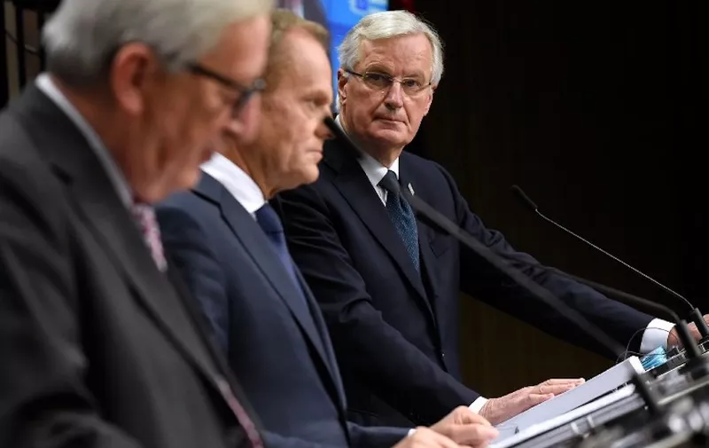 Froml left : President of the European Commission Jean-Claude Juncker, European Council President Donald Tusk and EU chief Brexit negotiator Michel Barnier give a press conference after a special meeting of the European Council to endorse the draft Brexit withdrawal agreement and to approve the draft political declaration on future EU-UK relations on November 25, 2018 in Brussels. (Photo by JOHN THYS / AFP)
