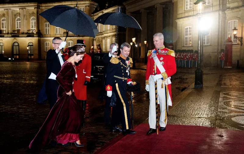 Denmark's future king and queen, Crown Prince Frederik and Crown Princess Mary arrive for the New Year's banquet at Amalienborg Castle, Copenhagen, on January 1, 2024. Danes were on January 1, 2024 slowly coming to terms with Queen Margrethe's surprise announcement that she will abdicate on January 14 in favour of her son after 52 years on the throne. (Photo by Keld Navntoft / Ritzau Scanpix / AFP) / Denmark OUT