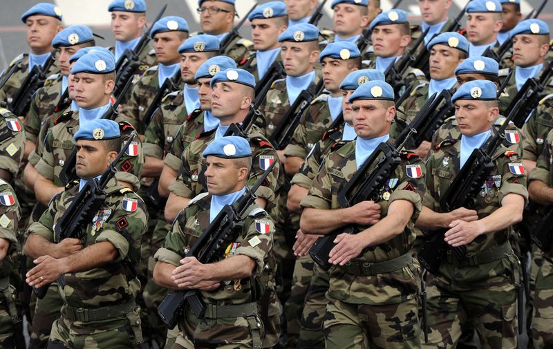 Peacekeepers from the United Nations Interim Force in Lebanon (UNIFIL) (In French : FINUL) take part in the annual Bastille Day military parade on the Champs-Elysees in Paris July 14, 2012. AFP PHOTO / BERTRAND GUAYBERTRAND GUAY/AFP/GettyImages ORG XMIT: FRANCE-BA