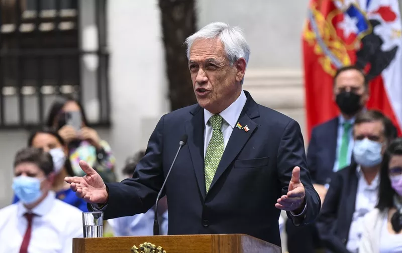 (FILES) Chilean President Sebastian Piñera speaks during the signing of a law legalizing same-sex marriage in Chile, at La Moneda Palace in Santiago on December 9, 2021. The former President of Chile, Sebastian Piñera, died this Tuesday February 6, 2024 in a helicopter accident in Lago Ranco, a vacation area 920km south of Santiago, his office reported. (Photo by MARTIN BERNETTI / AFP)