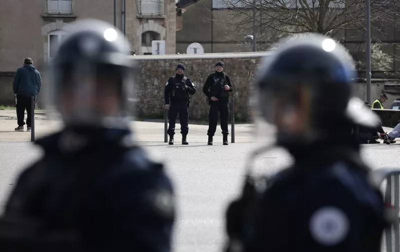 French police officers stand guard as they take part in a exercise drill simulating a terrorist attack, in front of the Paul-Lignon stadium in Rodez, southwestern France, on March 28, 2024. (Photo by Valentine CHAPUIS / AFP)