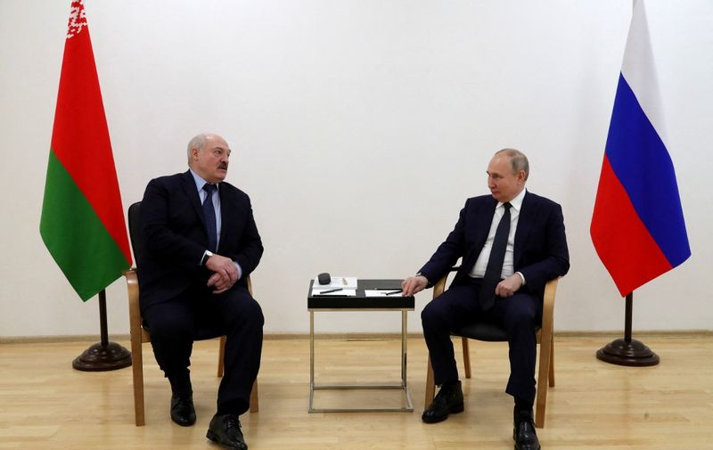Russia's President Vladimir Putin (R) speaks with Belarus President Alexander Lukashenko during their talks at the engineering building of the technical complex of the Soyuz-2 space rocket complex at the Vostochny Cosmodrome, some 180 km north of Blagoveschensk, Amur region, on April 12, 2022. (Photo by Mikhail KLIMENTYEV / Sputnik / AFP)