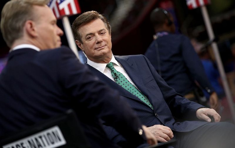 CLEVELAND, OH - JULY 17: Paul Manafort (R), campaign manager for Republican presidential candidate Donald Trump, is interviewed by journalist John Dickerson (L) on the floor of the Republican National Convention at the Quicken Loans Arena July 17, 2016 in Cleveland, Ohio. The Republican National Convention begins tomorrow.   Win McNamee/Getty Images/AFP