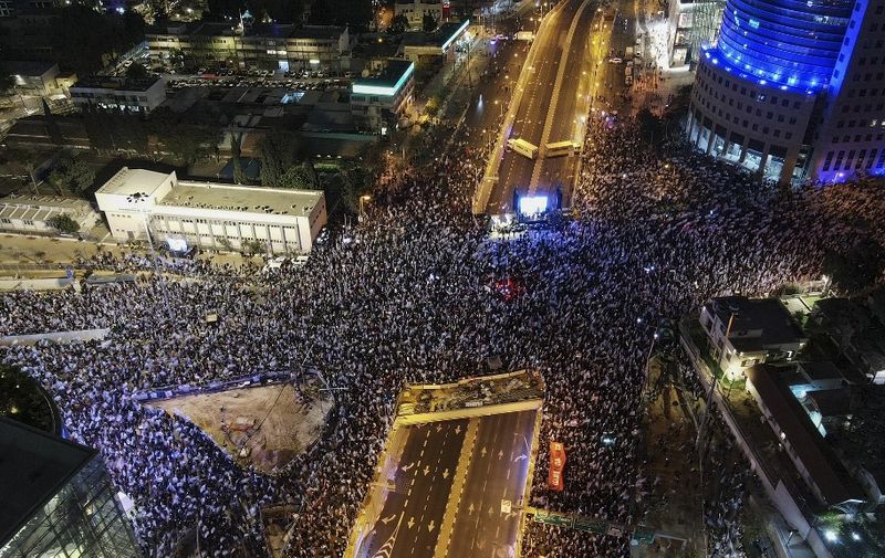 An aerial picture shows a protest against the Israeli government's controversial judicial reform bill in Tel Aviv on March 11, 2023. (Photo by JACK GUEZ / AFP)