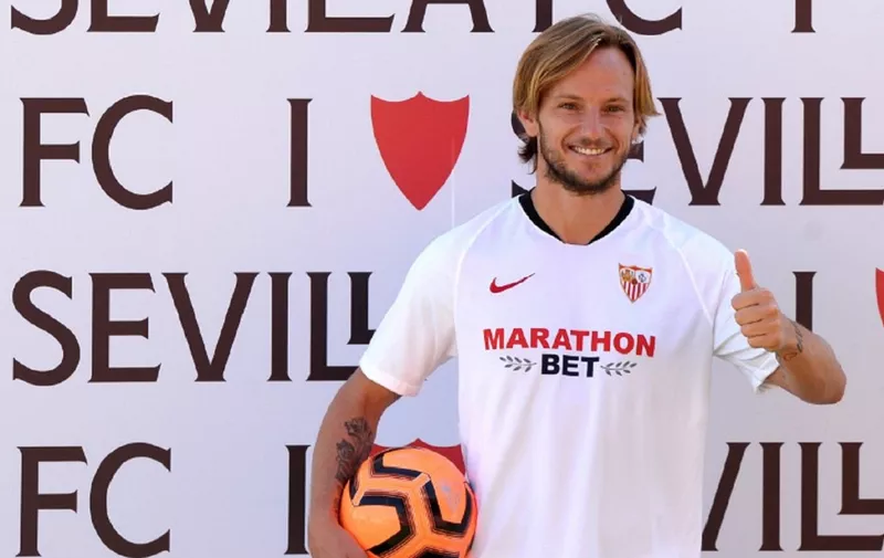Croatian midfielder Ivan Rakitic poses during his official presentation as new player of Sevilla FC at the Ciudad Deportiva Jose Ramon Cisneros Palacios training ground in the outskirts of Seville on August 3, 2020. (Photo by CRISTINA QUICLER / AFP)