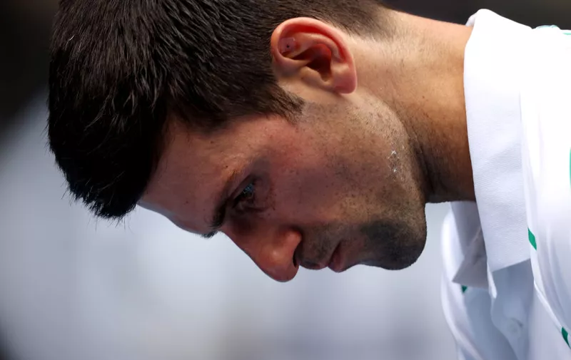 MELBOURNE, AUSTRALIA - JANUARY 24: Novak Djokovic of Serbia looks on during his Men's Singles third round match against Yoshihito Nishioka of Japan on day five of the 2020 Australian Open at Melbourne Park on January 24, 2020 in Melbourne, Australia. (Photo by Clive Brunskill/Getty Images)