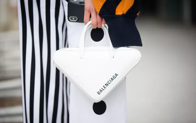 NEW YORK, NY - FEBRUARY 10: Jaime Xie poses outside of the Tibi show holding a white Balenciaga handbag during New York Fashion Week on February 10, 2019 in New York City.   Donell Woodson/Getty Images/AFP (Photo by Donell Woodson / GETTY IMAGES NORTH AMERICA / Getty Images via AFP)